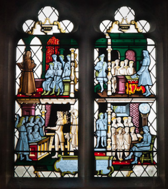 Stained Glass window depicting the history of the school